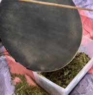 Dry sift screen with CBD kief caught on the mesh